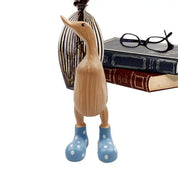 Escultura de Pato em Madeira com Botas de Chuva